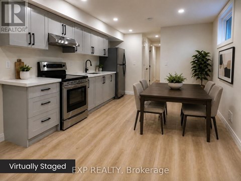 A kitchen with a table and chairs in the middle of the room.