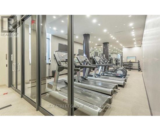 A gym with treadmills and other exercise equipment.