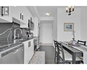A modern kitchen with a dining table and chairs.
