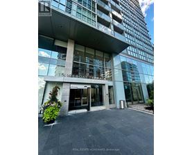 A modern building with a glass facade and a sign that reads "15 Iceboat Terrace".