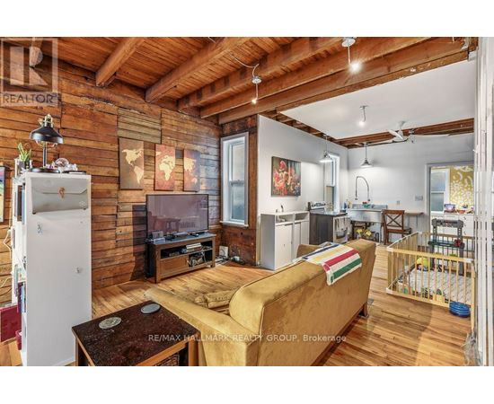 A living room with a couch and a television.