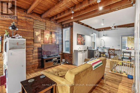 A living room with a couch and a television.