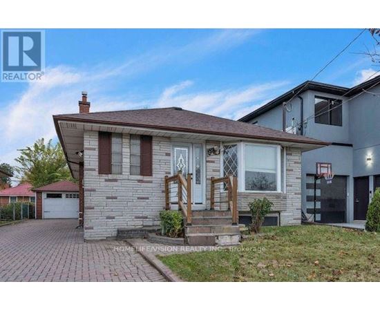 A house with a brown roof and a white garage door.