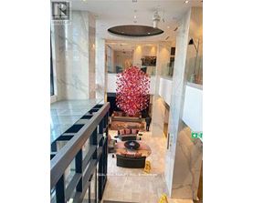 A large floral arrangement in the center of a spacious lobby.