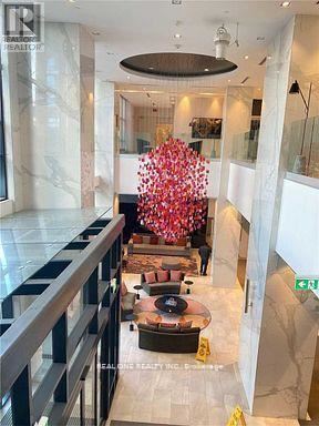 A large floral arrangement in the center of a spacious lobby.