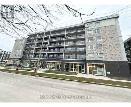 A large apartment building with multiple balconies and windows.