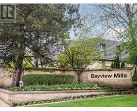 A sign that says Bayview Mills in front of a building.