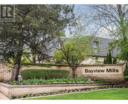 A sign that says Bayview Mills in front of a building.