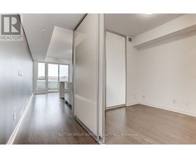 A room with a sliding door and a window.