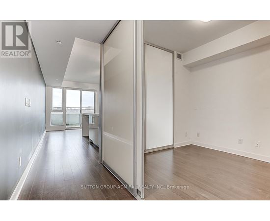 A room with a sliding door and a window.