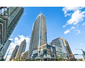 A cityscape with a tall skyscraper in the center.