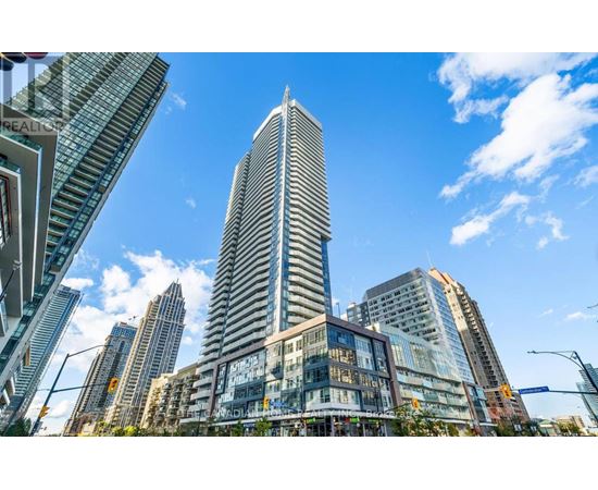 A cityscape with a tall skyscraper in the center.