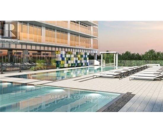 A modern building with a pool in front and a sign that says "REALTOR".