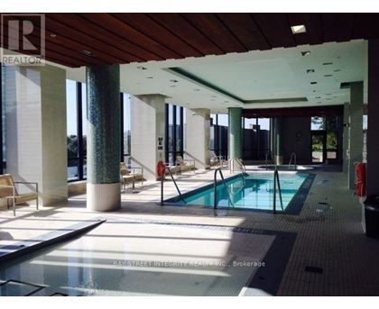A pool area with a sign that says REALTOR.