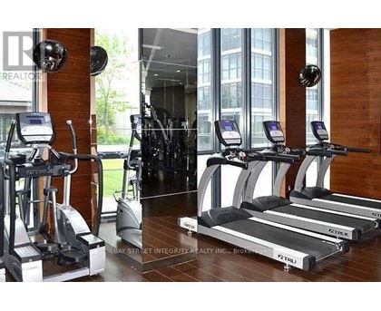 A gym with treadmills and exercise bikes.