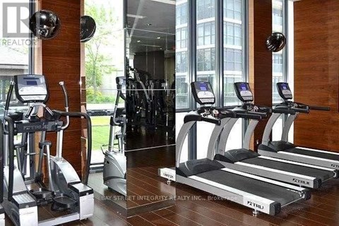 A gym with treadmills and exercise bikes.