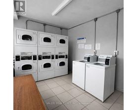 A brokerage office with a row of washing machines.