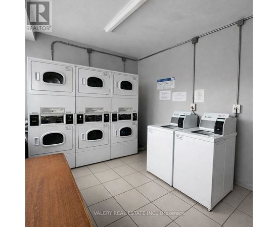 A brokerage office with a row of washing machines.