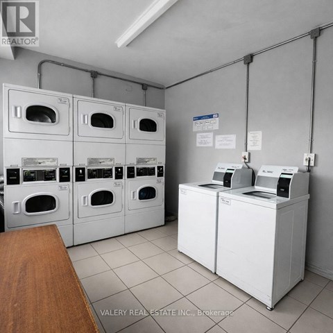 A brokerage office with a row of washing machines.