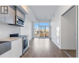 A modern kitchen with a view of the city.