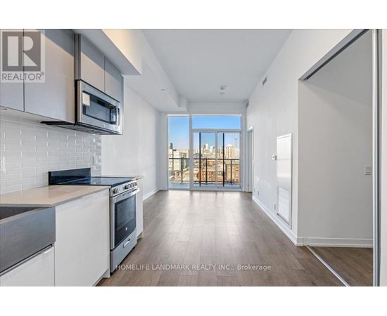 A modern kitchen with a view of the city.
