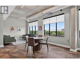 A room with a table and chairs in it.