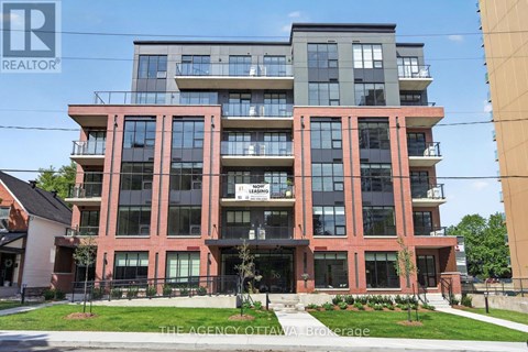 A multi-story building with a sign that reads "REALTOR" on the front.