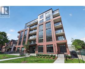 A modern multi-story building with a glass facade and a red brick exterior.