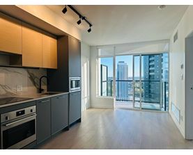 A modern kitchen with a view of the city.