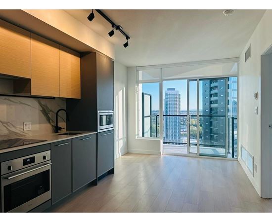 A modern kitchen with a view of the city.