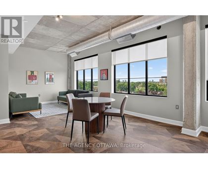 A room with a table and chairs in it.