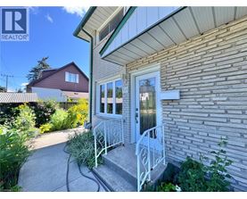 A house with a white door and a small porch.