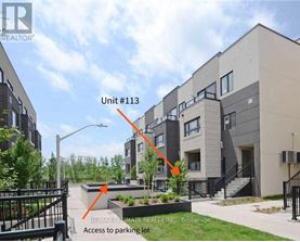 A building with the label Unit #113 and access to a parking lot.