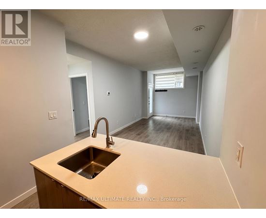 A kitchen with a sink and a countertop.