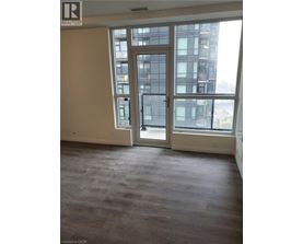 A room with a large window and a sliding glass door.
