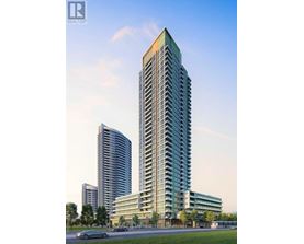 A modern high-rise building with a glass facade stands tall in an urban setting.