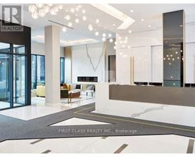 A foyer with a marble floor and a glass door.