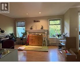A room with a fireplace and a ladder is shown.