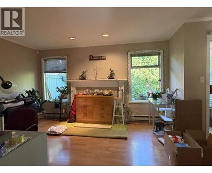 A room with a fireplace and a ladder is shown.