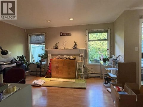 A room with a fireplace and a ladder is shown.