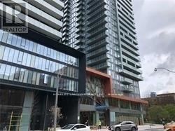 A modern building with a glass facade and a sign that reads "REALTOR".