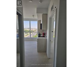A real estate office with a view of the city.