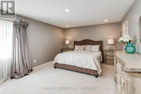 A bedroom with a large bed, a dresser, and a mirror.
