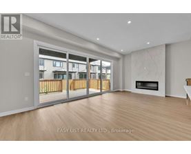 A spacious living room with a fireplace and sliding glass doors.