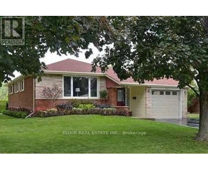 A house with a red roof and a garage door.