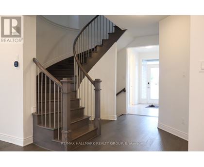 A staircase with a metal railing and wooden steps.