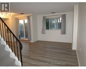 A room with a staircase leading to the upper floor.
