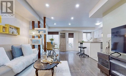 A modern living room with a white sofa and a coffee table.