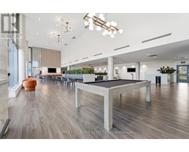 A spacious room with a pool table and a ping pong table.