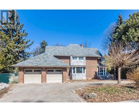 A house with a garage is for sale.